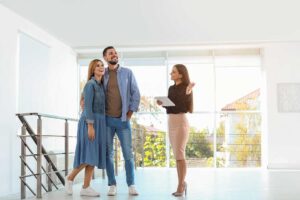 A buyer reviews a property listing beside a floor plan and home inspection notes.